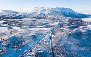 Aerial sunny winter view of Abisko National Park, Kiruna Municipality, Lapland, Norrbotten County, Sweden, shot from drone, with r photo