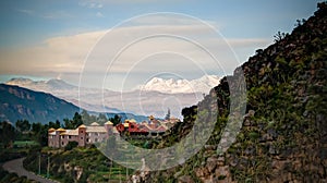 Aerial sunrise panoramic view Colca river and Sabancaya mountain, Chivay, Peru