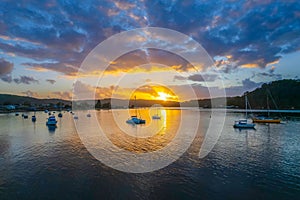 Aerial sunrise waterscape with boats