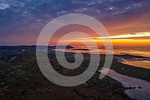 Aerial of sunset above Clooney, Narin and Portnoo in County Donegal - Ireland. photo