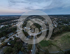 Aerial sunset landscape of forest and suburban neighborhood in Evans Augusta Georgia