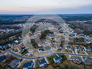 Aerial sunset landscape of forest and suburban neighborhood in Evans Augusta Georgia