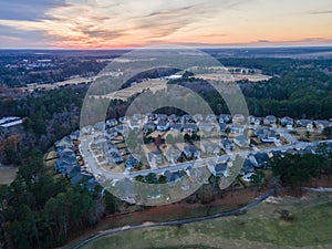 Aerial sunset landscape of forest and suburban neighborhood in Evans Augusta Georgia