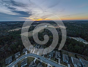 Aerial sunset landscape of forest and suburban neighborhood in Evans Augusta Georgia