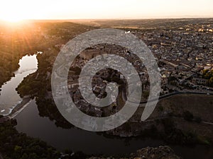 Aerial sunset panorama of historic medieval Toledo cityscape skyline at Tagus river in Castilla La Mancha Spain Europe