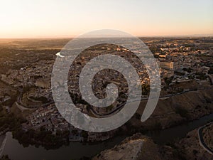 Aerial sunset panorama of historic medieval Toledo cityscape skyline at Tagus river in Castilla La Mancha Spain Europe