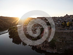 Aerial sunset panorama of historic medieval Toledo cityscape skyline at Tagus river in Castilla La Mancha Spain Europe