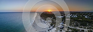 Aerial sunset seascape of famous Altura beach, Algarve photo