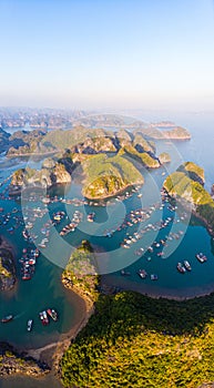 Aerial sunset view of Lan Ha bay and Cat Ba island, Vietnam, unique limestone rock islands and karst formation peaks in the sea,