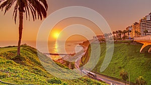 Aerial sunset view of Lima's Coastline in the neighborhood of Miraflores timelapse, Lima, Peru photo