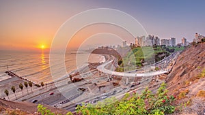Aerial sunset view of Lima's Coastline in the neighborhood of Miraflores timelapse, Lima, Peru photo