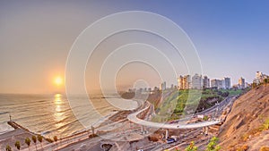 Aerial sunset view of Lima's Coastline in the neighborhood of Miraflores timelapse, Lima, Peru photo