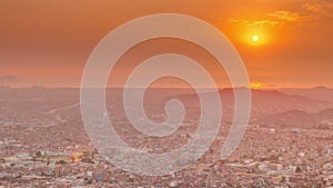 Aerial sunset view of Lima skyline timelapse from San Cristobal hill.
