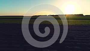 Aerial sunset view over agricultural fileds in the countryside