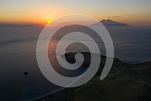 Aerial of Sunset and Volcano in Indonesia photo