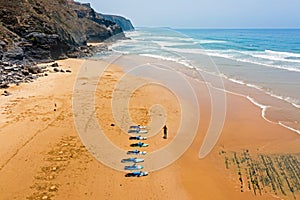 Aerial from surfers getting surfers lessons at Praia Vale Figueiras in Portugal