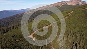 Aerial Survey Of Mountain With A Tourists On A Path