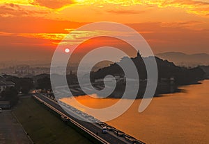 Aerial Taigong Mountain with huge statue of Jiang Taigong & Tianmu Lake at sunrise photo