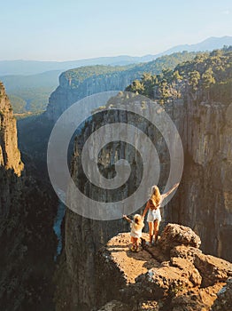 Aerial Tazi canyon view mother and child on cliff family travel hiking outdoor exploring Turkiye photo