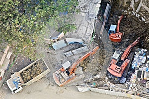Aerial of three diggers moving earth photo