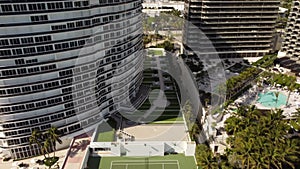 Aerial tilt up reveal Bal Harbour Miami FL condominiums 4k