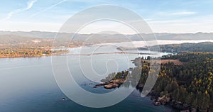 Aerial time lapse of a bank of sea fog moving down a bay over a the rugged Vancouver Island coastline. - 4K 24FPS