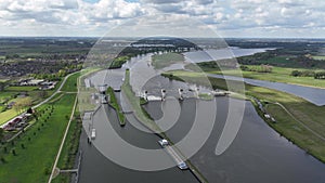 Aerial time lapse or hyperlaspe of Hydroelectric power station Alphen aan de Maas. Generating electricity from flow of a