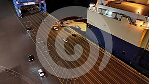 Aerial Timelapse of New Cars Being Unloaded from Vehicle Car Carrier Ship