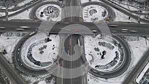 Aerial timelapse of road junction, large car interchange. Aerial highway junction at winter evening, Colorcorrected 4k