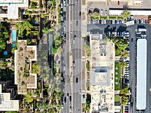 Aerial to view of road and building in Scottsdale desert city in Arizona east of state capital Phoenix.