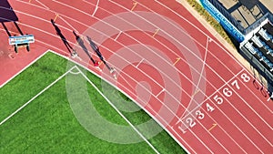 Aerial Top Down of Athletic Track and Field with Active Runners in Indianapolis
