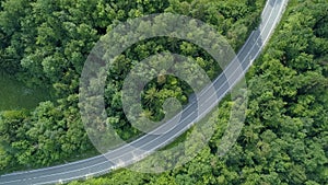 AERIAL TOP DOWN: Cinematic view of empty country road in rural part of Slovenia.