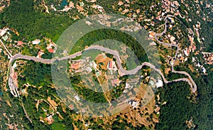 Aerial top down daytime view of Sorrento coast, Italy. Streets of city with hotels and restaurants are located on rocky seashore.