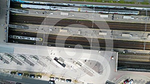 Aerial top down footage of railway station transportation hub showing the different trains parked next to each other on