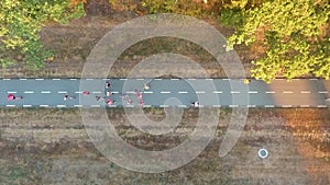 Aerial top down of marathon racers running on road