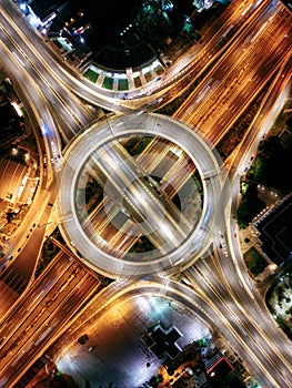 Aerial top down night view of a multilevel junction highway