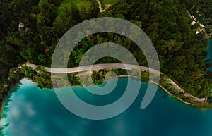 Aerial top down panoramic view of Lake Bled. Cloudy weather, heavy thunderstorm clouds on the horizon. Summer day. Season of tour