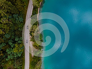 Aerial top down panoramic view of Lake Bled road and cars. Cloudy weather. Summer day. Season of tour and travel. Triglav,