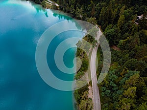 Aerial top down panoramic view of Lake Bled road and cars. Cloudy weather. Summer day. Season of tour and travel. Triglav,