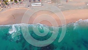 Aerial, top down, tracking over waves and turquoise sea, Cabo San Lucas Mexico