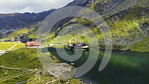 Aerial top down view Balea mountain lake. Romania Transfagarash. Shot on drone. Famous tourism travel destination