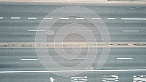 Aerial top down view of city road with bus lanes