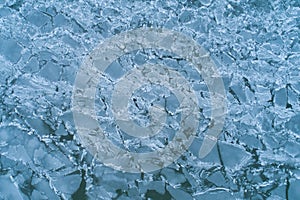 Aerial Top-Down View of Cracked, Broken, and Melting Ice on a Water Surface