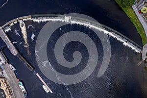 Aerial top down view on a dam and lock system. Water level management. Athlone, Ireland