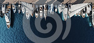 Aerial top-down view of docked sailboats