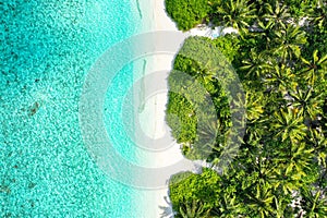 Aerial top down view of an exotic island with crystal water and sandy beach