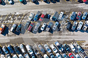Aerial top down view many cars on a parking lot of supermarket