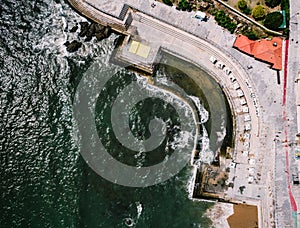 Aerial top down view of Oceanic Pool Alberto Romano in Cascais, Portugal