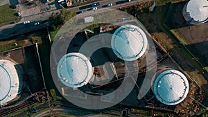 Aerial top down view of oil tanks at oil refinery. Gas and oil steel storage tanks. Petrol industrial plant