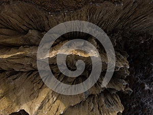 Aerial top down view of Omarama Clay Cliffs geological erosion silt and sand rock formation in Canterbury New Zealand